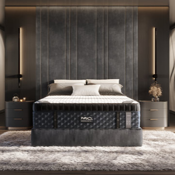 A luxury hybrid mattress by Puffy, shown in a stylishly furnished bedroom setting, highlighting the mattress's cooling, hybrid design.